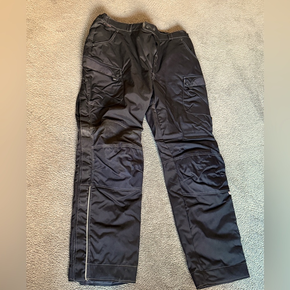 OLYMPIA BIKER PANTS. Hip pads & Knee armor. Lined. NWOT- Legs zip & hook & loop.